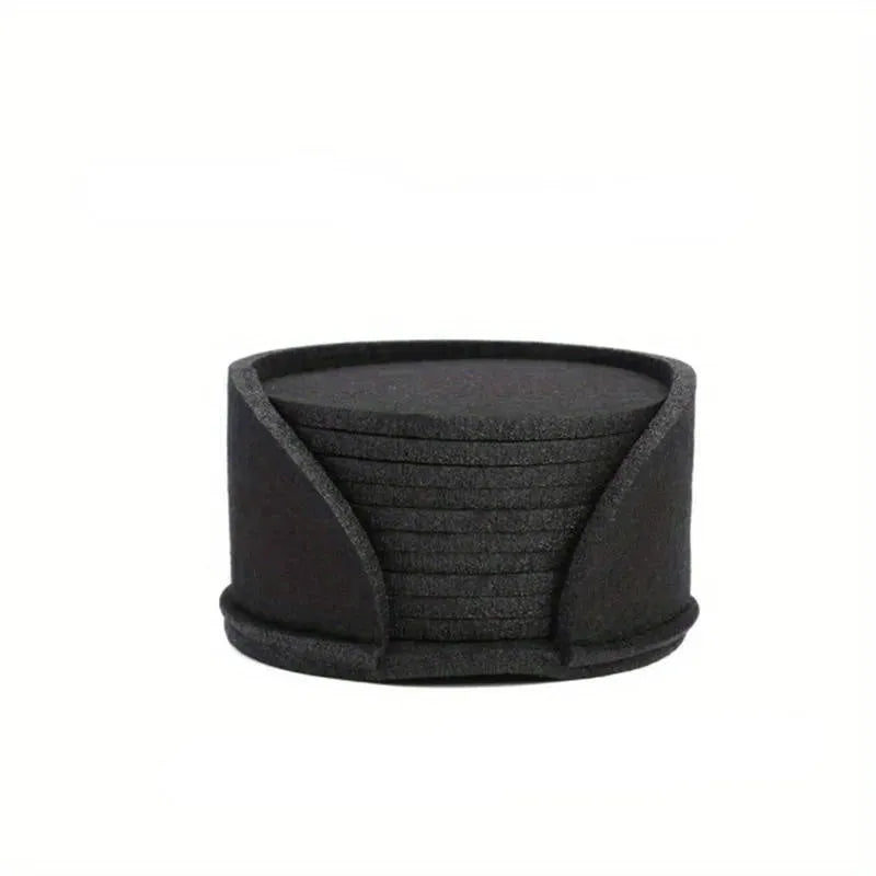 Round felt coaster set of 10 heat resistant drink mats in black, brown, dark gray, and light gray on a wooden table