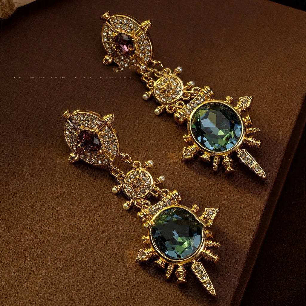 Gold geometric retro stud earrings with round shape and diamond treatment surface