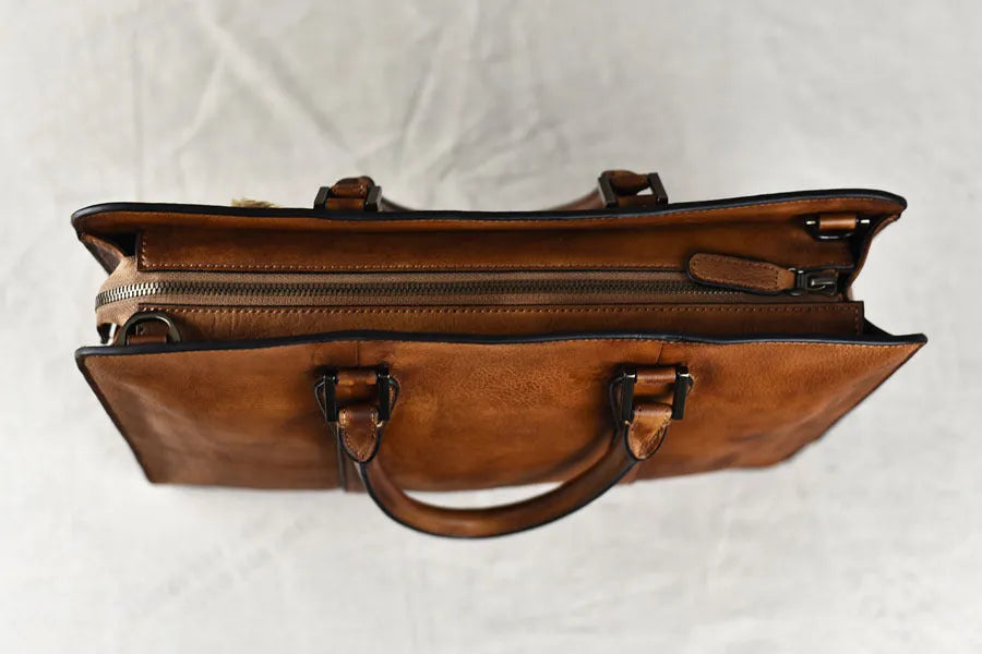 Men's 14-inch vegetable tanned leather handbag in horizontal square design with zipper