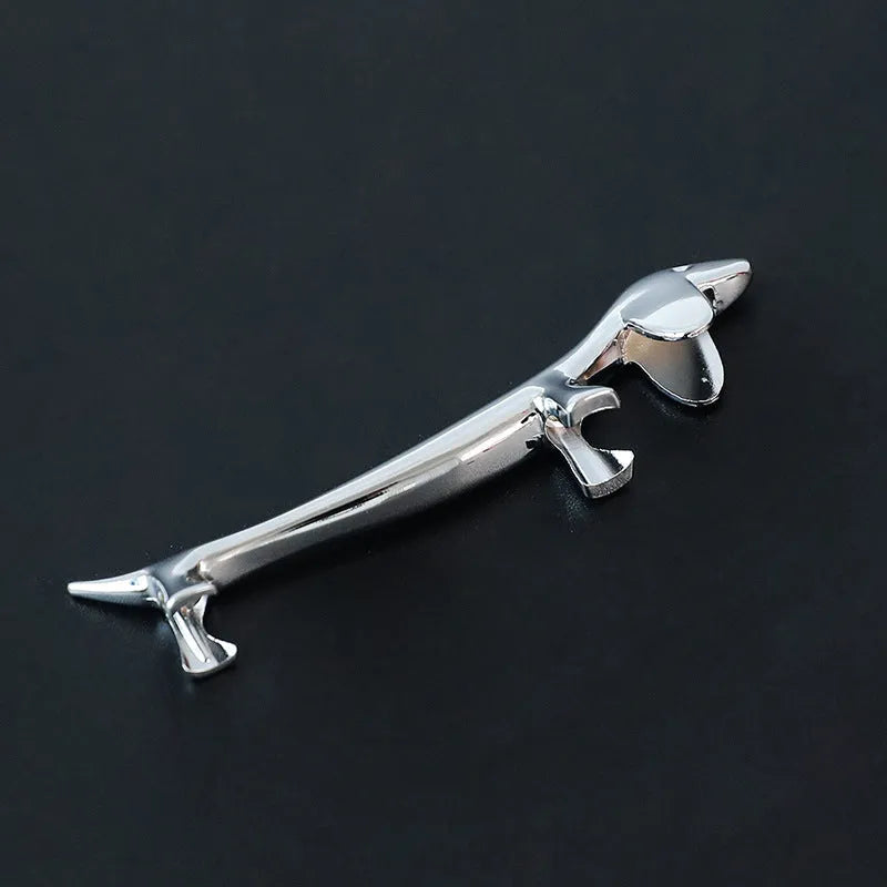 Silver zinc alloy sausage dog shaped chopstick rest on a table