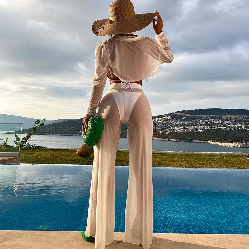 White women's swimsuit four-piece set showing backless top and high-waisted trousers