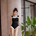 Korean style triangle top one-piece swimsuit for women with high waist in black colour.