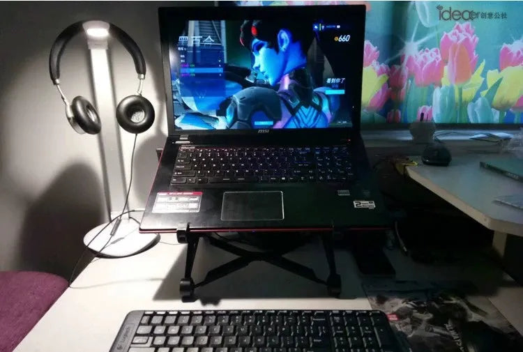 Black foldable portable laptop stand made of enhanced nylon with carrying case