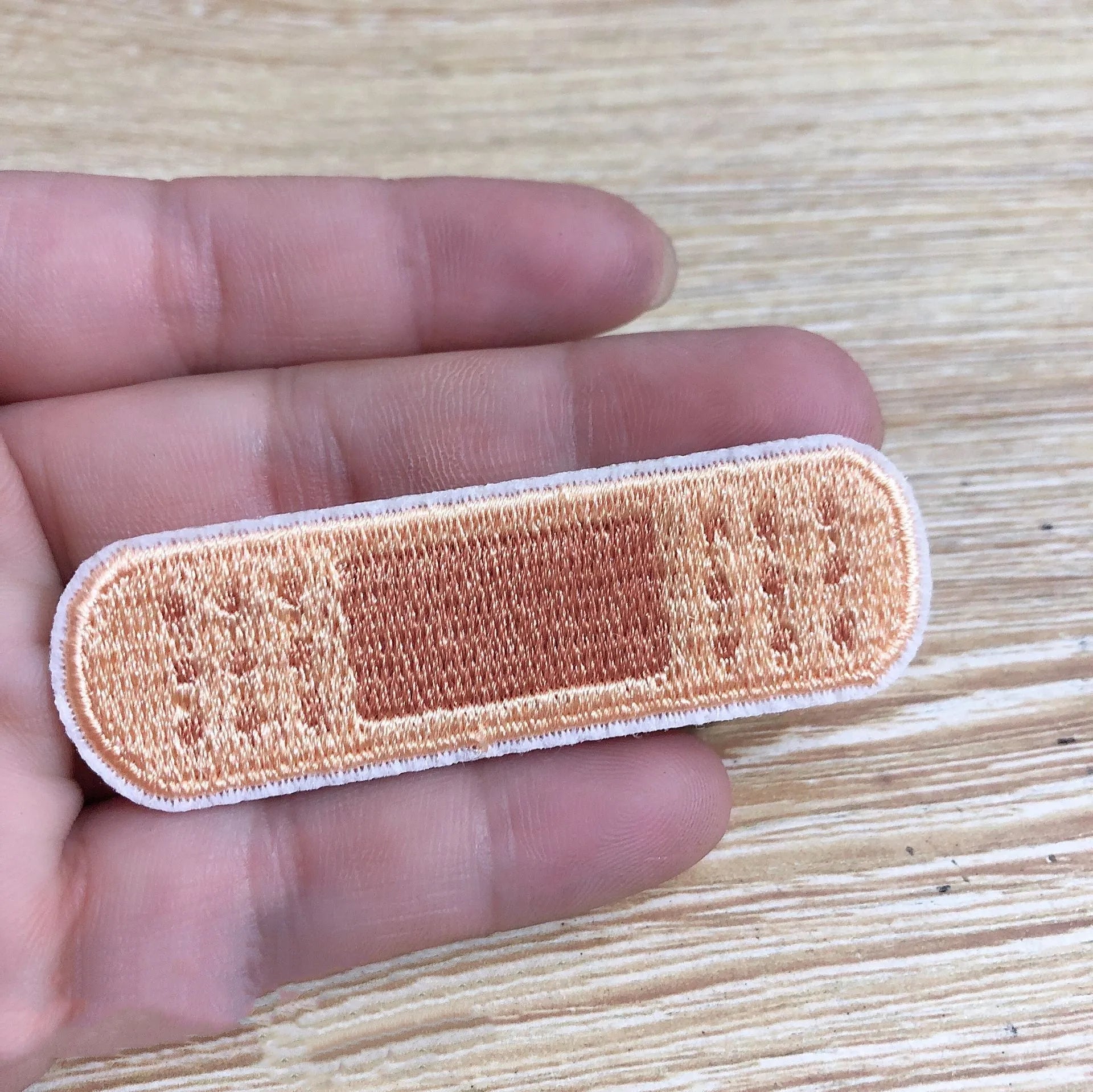 Pack of ten embroidered cloth patch badges in various designs for DIY clothing customisation.