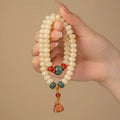 Milk butter Bodhi wooden bracelet with 6x9mm flat round beads and double ring design