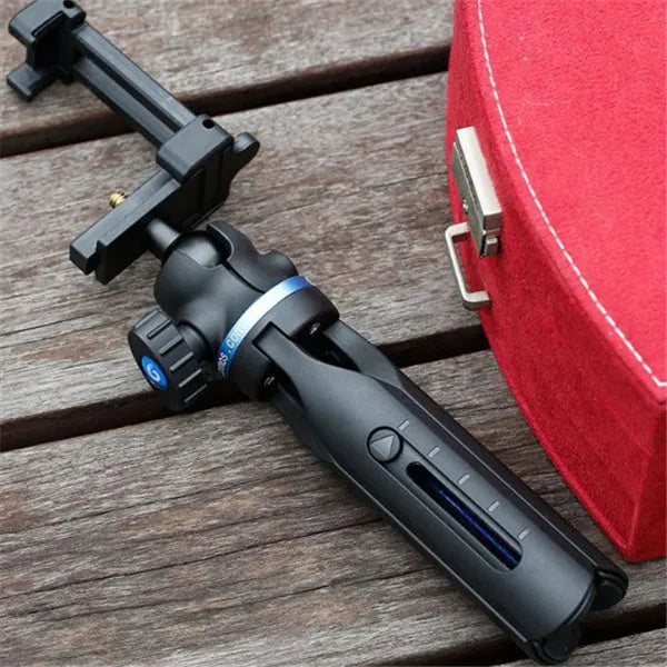 Black desktop phone tripod made of aluminium alloy and plastic, holding a smartphone.