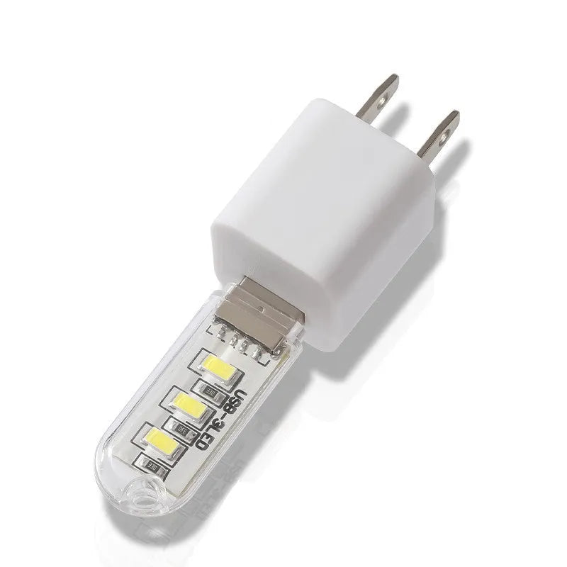 Small white USB-powered LED baby night light showing dual white and warm light options