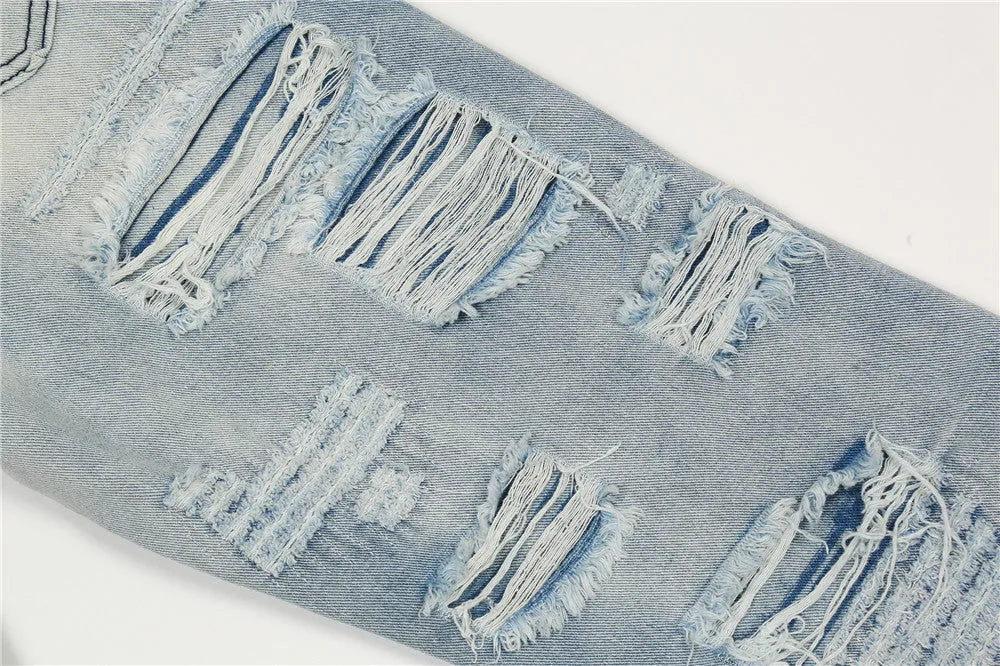 Men's flared washed jeans in light blue denim with zipper fly