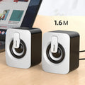 Pair of small black and white desktop speakers with USB power, 3.5mm aux, dual 4Ω 3W horns and bass boost