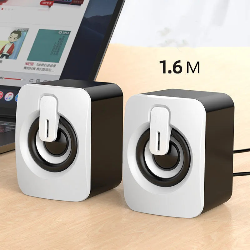 Pair of small black and white desktop speakers with USB power, 3.5mm aux, dual 4Ω 3W horns and bass boost