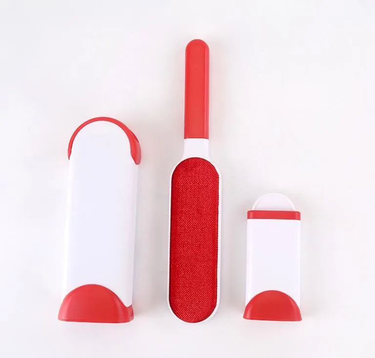 Blue self-cleaning pet hair remover brush with double-sided roller next to its cleaning base.