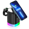 Black foldable 3 in 1 wireless charging station showing phone, watch, and earbuds charging simultaneously with RGB light