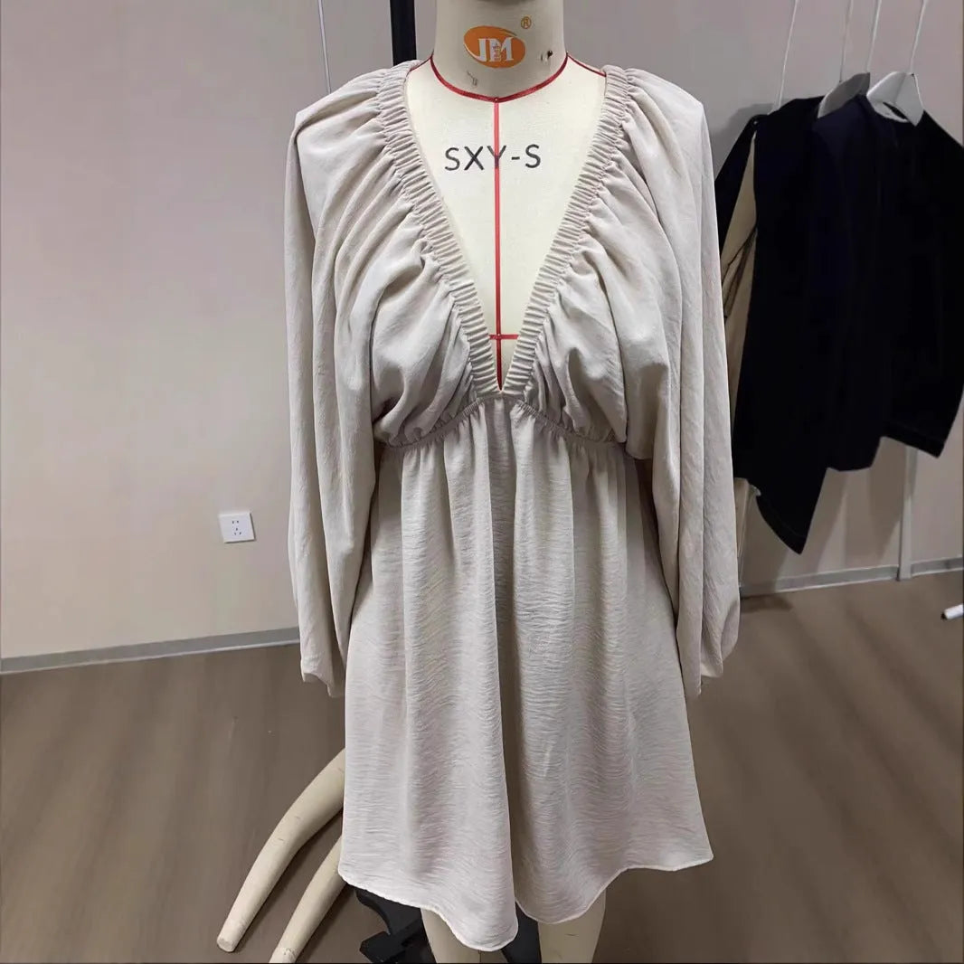 Women's V-neck dress with puff sleeves and flounced swing skirt in polyester fabric