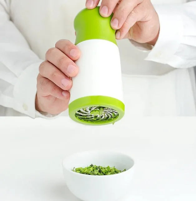 Hand-held herb grinder and spice mill with microplane cutting blade for chopping fresh herbs