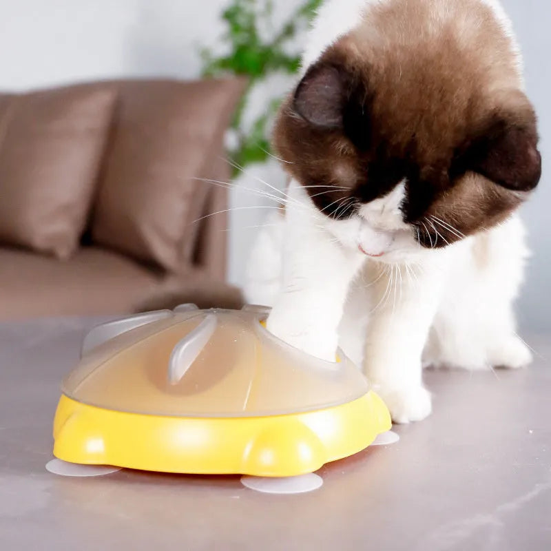 Bright yellow interactive cat toy and snack bowl for pet entertainment and feeding.