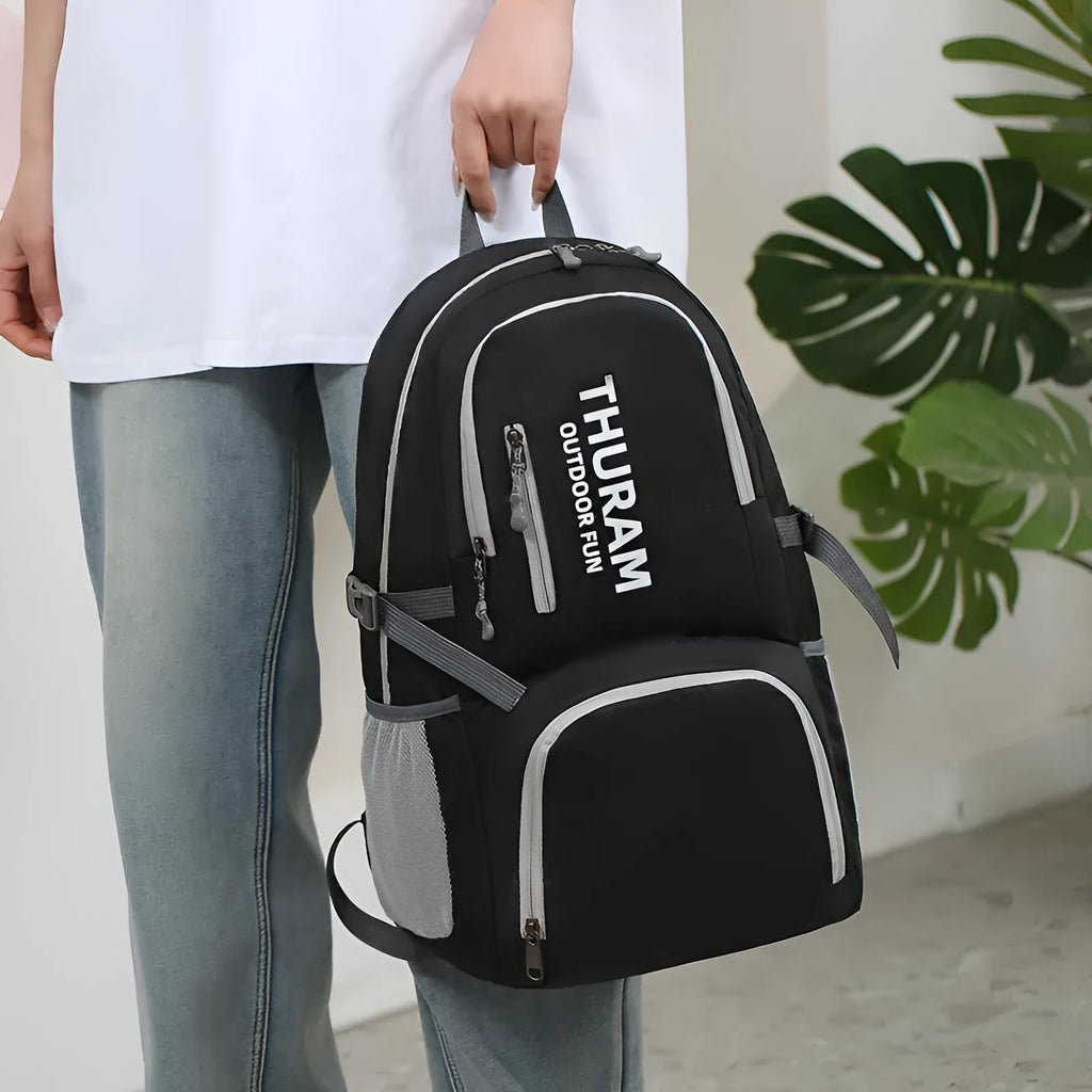 Outdoor backpack in dark blue with air-cushioned shoulder straps and large main compartment