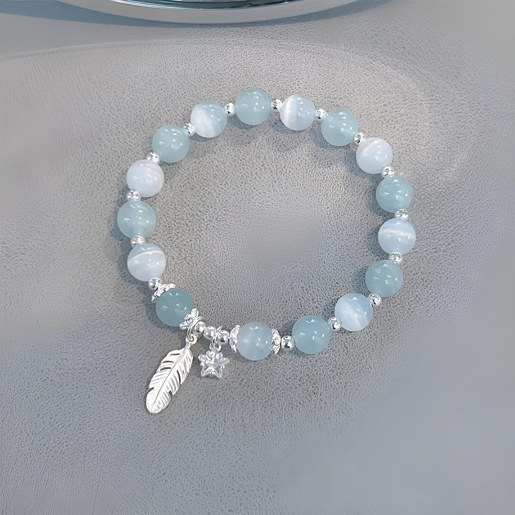Small white girl crystal bracelet with feather XINGX blue moonlight colour and eight awn star details