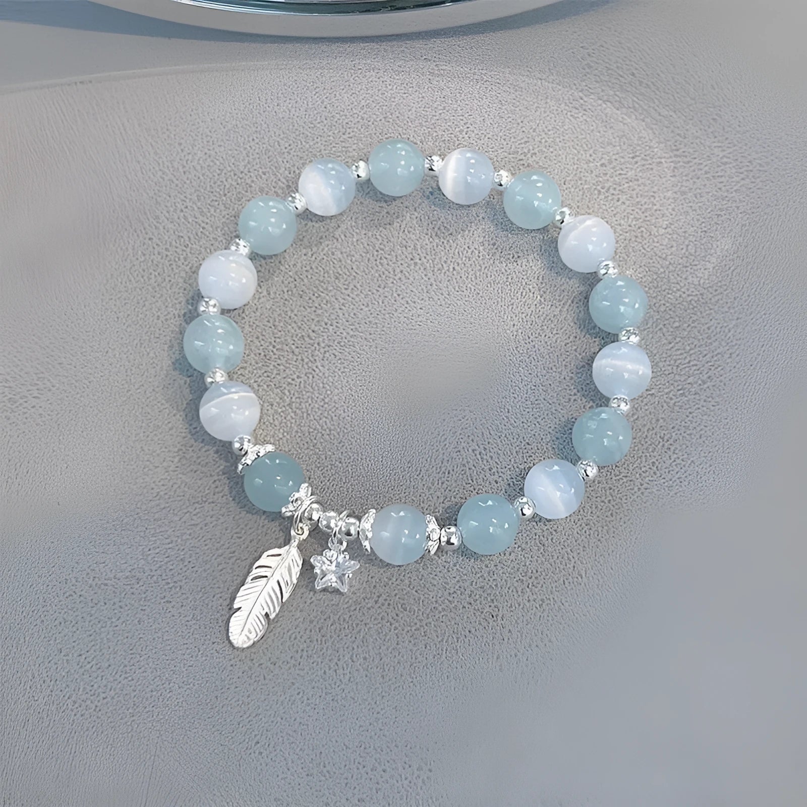 Small white girl crystal bracelet with feather XINGX blue moonlight colour and eight awn star details