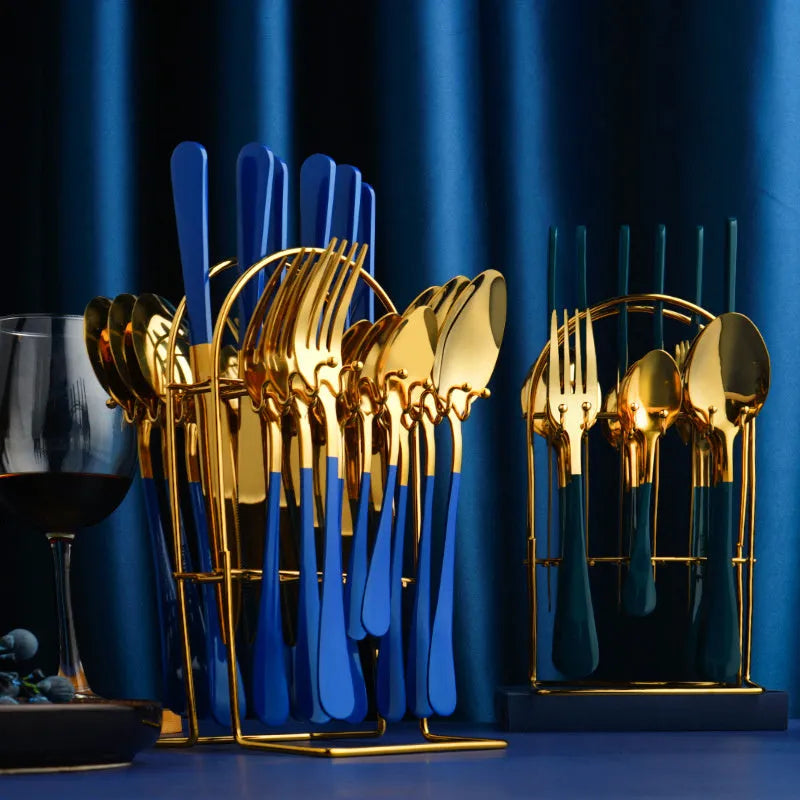 24-piece gold stainless steel cutlery set with knives, forks, spoons and a storage rack.
