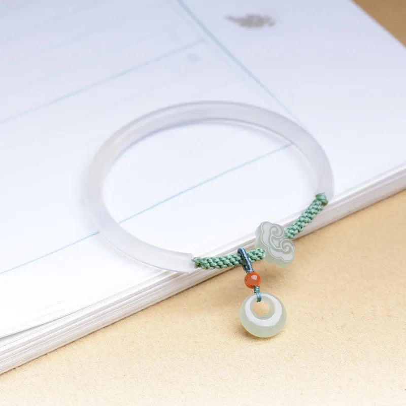 Handmade natural white agate bracelet with jade green Hetian jade charm on an adjustable cord.