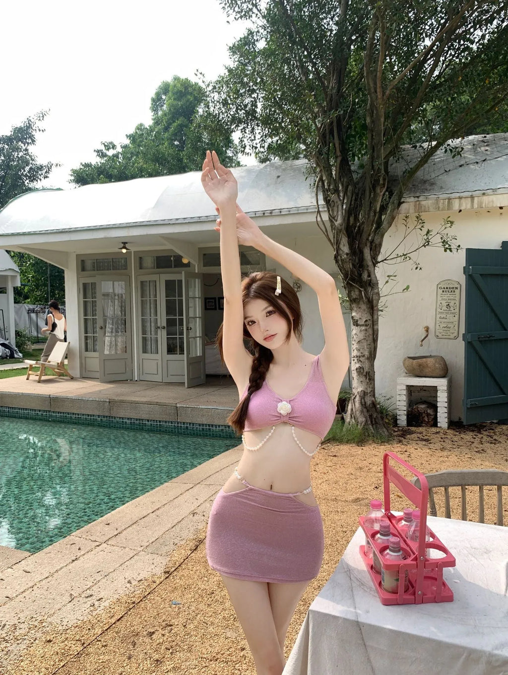 Women's three-piece bikini set in pink or black colours with briefs style and sleeveless design