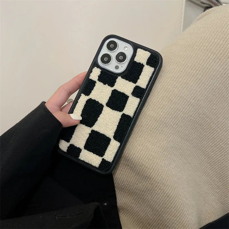 Black and white lattice silicone back cover for Apple iPhone, protective case on a white background