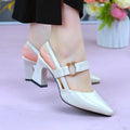 Women's apricot coloured leather sandals with a closed toe, open back, and a chunky high heel.