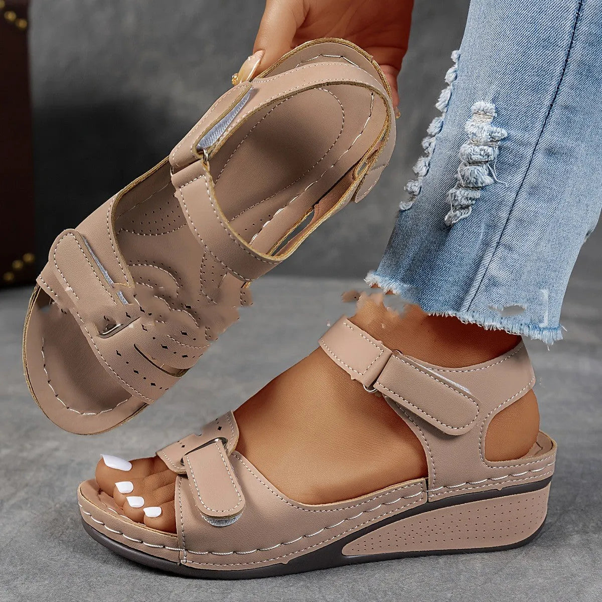 Women's beige plus size sandals with a thick composite sole and an adjustable Velcro strap fastener.