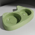 Two-in-one stainless steel slow feed cat bowl with large and small eye compartments, anti-choking design, in blush pink