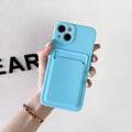 Sky blue silicone iPhone case with a card slot on the back for iPhone 16 and older models.