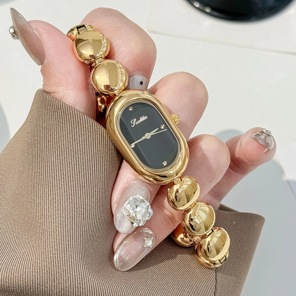 Women's oval dial watch with bracelet strap in multiple colour finishes including gold and platinum options