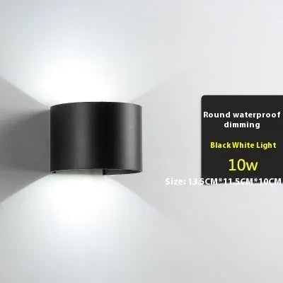 Modern black wall lamp with aluminium body, glass shade, and integrated LED light source.