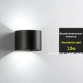 Modern black wall lamp with aluminium body, glass shade, and integrated LED light source.