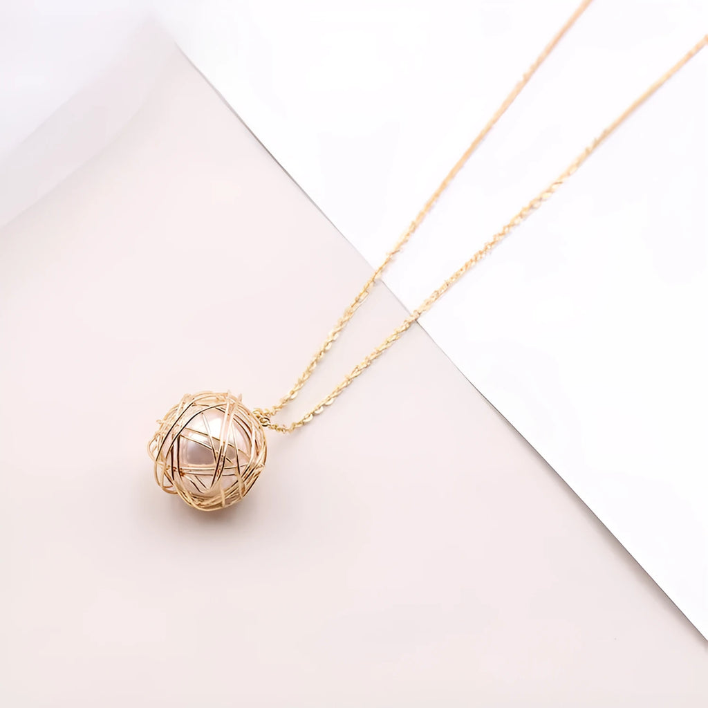 Gold minimalist pendant necklace with hollow ball and imitation pearl on twist chain 78cm