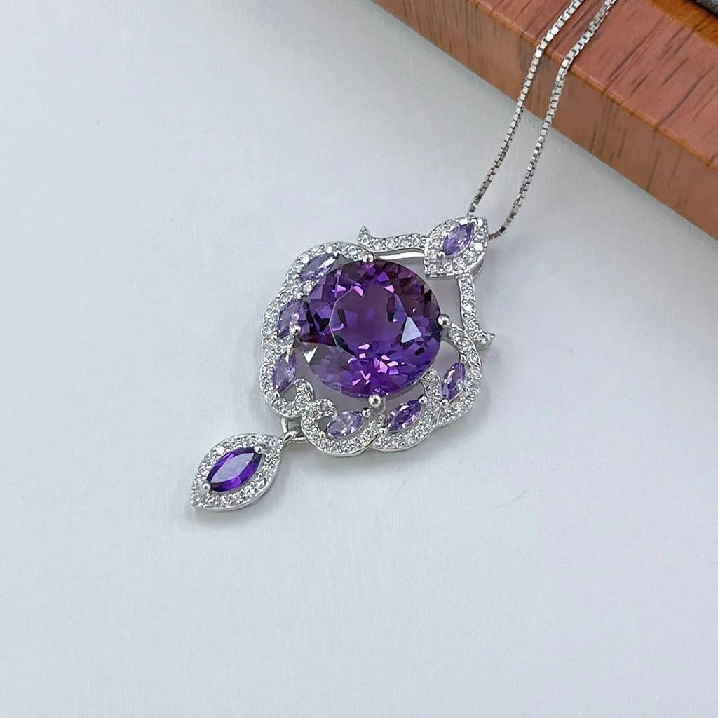 Purple amethyst stone set in platinum-plated silver U-shaped pendant with meteor shower pattern