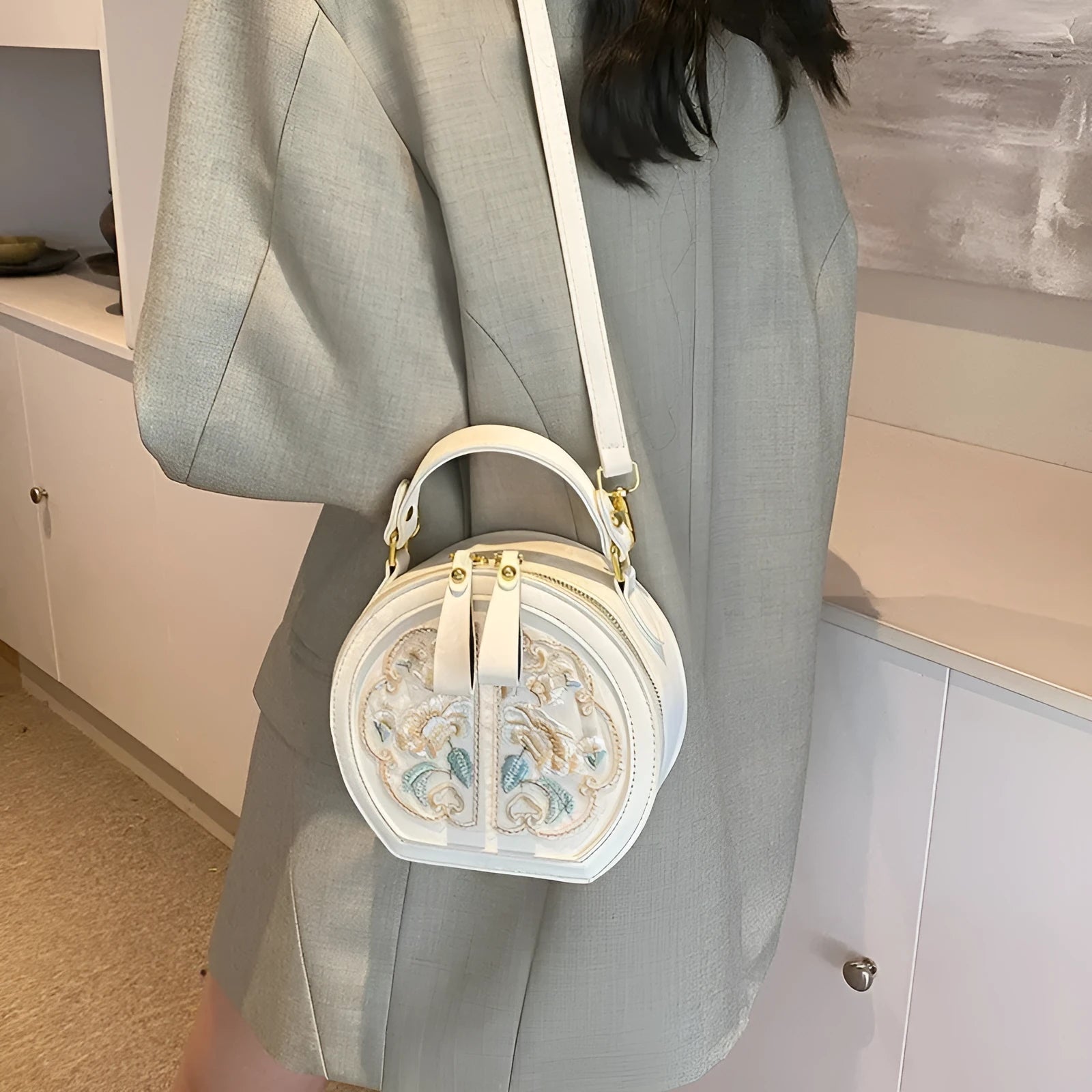 Soft PU Chinese embroidery messenger bag in horizontal square shape with adjustable shoulder strap.