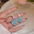 Candy stud earrings with heart-shaped peach design in pink and blue alloy jewellery options
