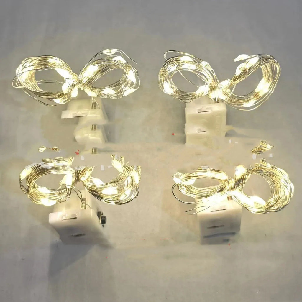 LED copper wire light in small white box with three-gear adjustment and 0.2m chain of four warm white LEDs