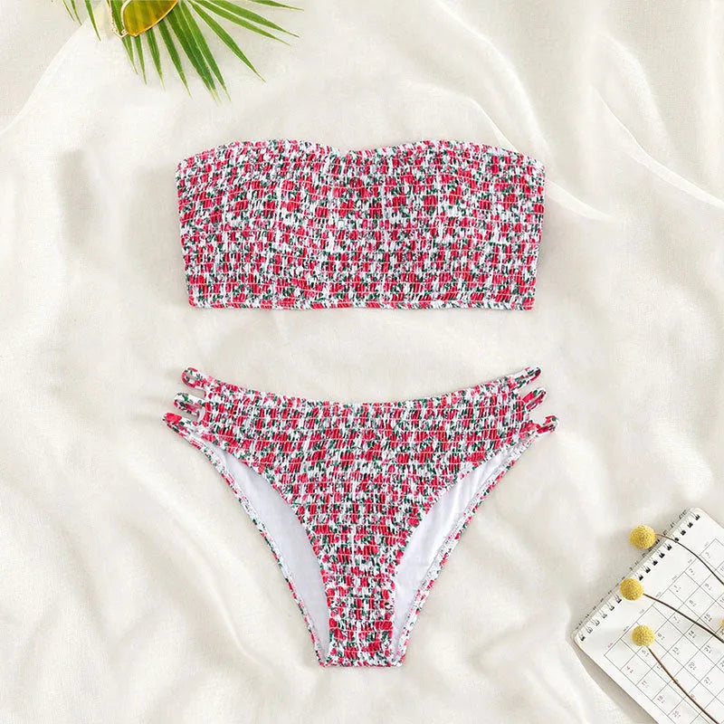 Women's floral strapless swimsuit with split back design and high waist briefs in green or purple flower patterns