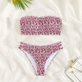 Women's floral strapless swimsuit with split back design and high waist briefs in green or purple flower patterns