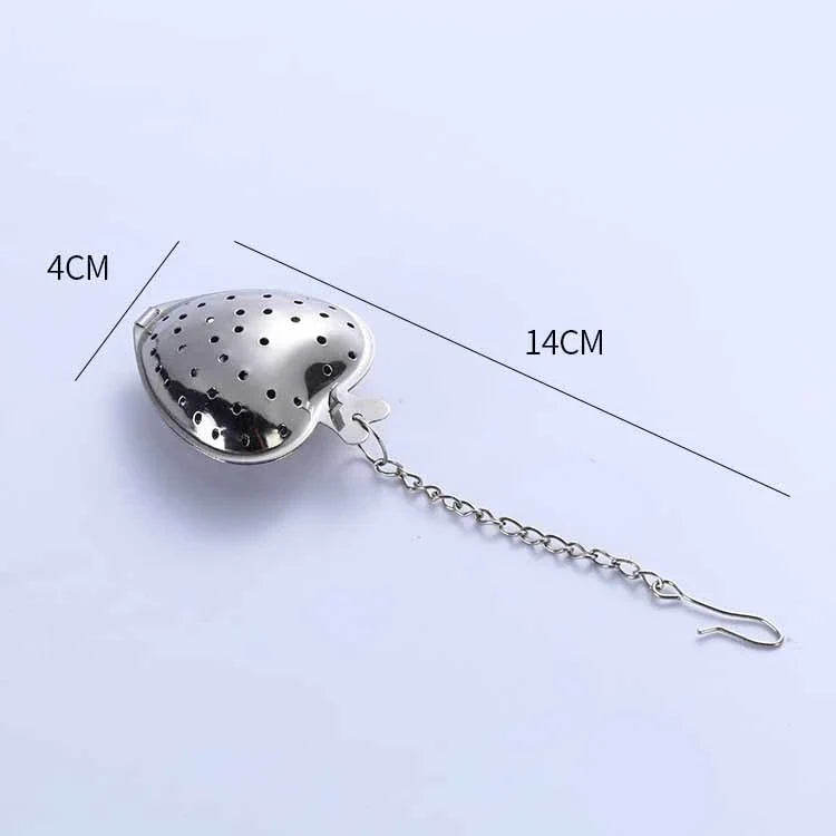 Heart-shaped stainless steel tea infuser with chain, perfect for steeping loose-leaf teas and spices