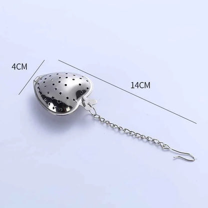 Heart-shaped stainless steel tea infuser with chain, perfect for steeping loose-leaf teas and spices