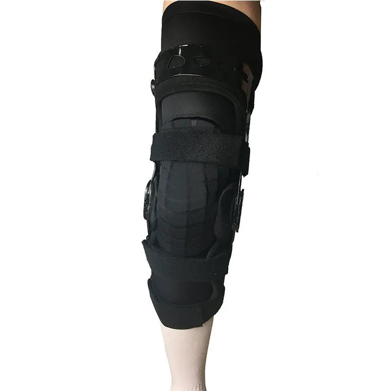 Black anterior ligament knee pad and supporter showing brushed cloth exterior with sponge cushioning