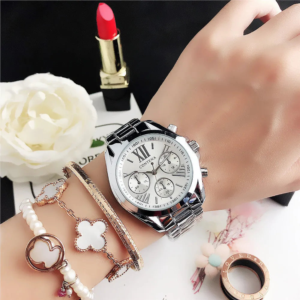 Women's silver rose gold fashion watch with mesh strap and pointer display.