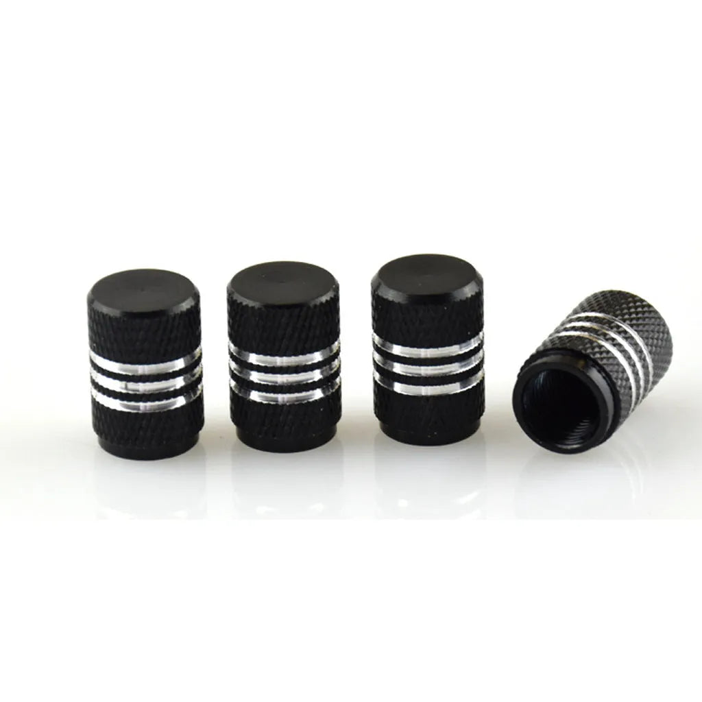 Set of aluminium alloy car tyre valve caps in multiple colours including red, blue, silver, and black.