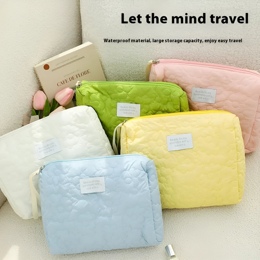 Women's silk quilted storage bag in pink candy colour showing quilted texture and medium size