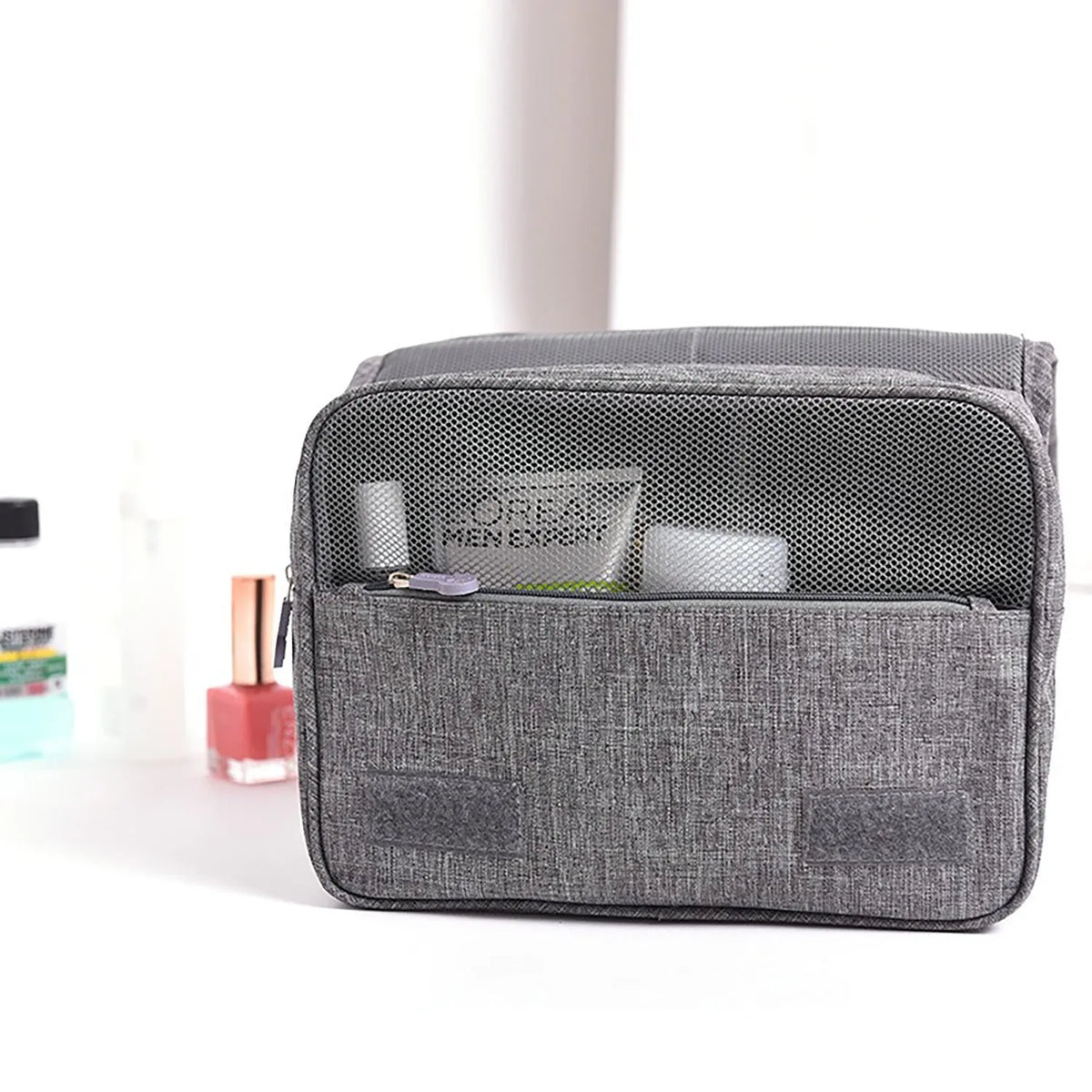Waterproof nylon hanging toiletry bag with four zippered compartments and swivel hook, available in six colours.