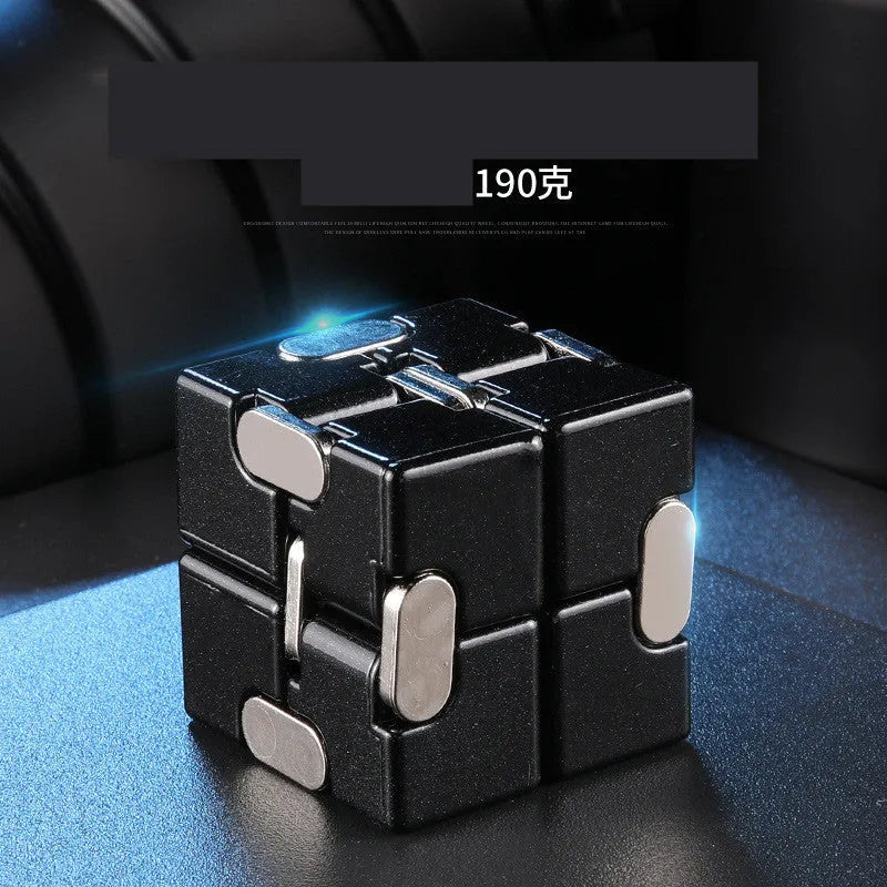 Zinc alloy infinity cube fidget toy in black or silver, showing rotating cubes on a 4cm scale.