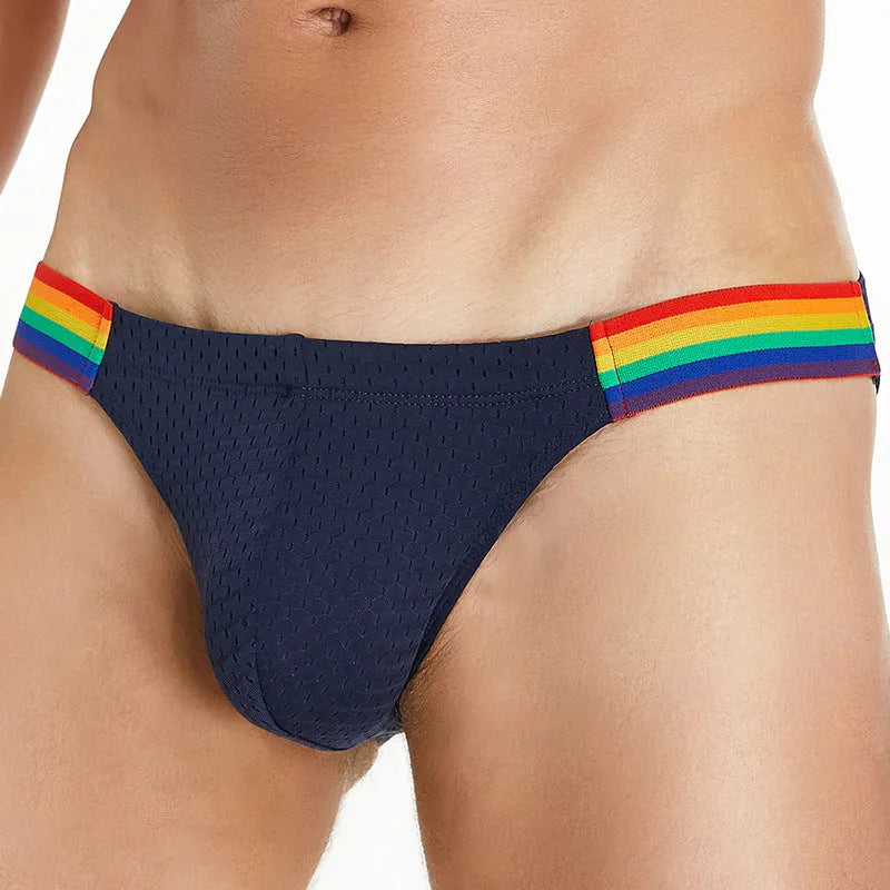 Men's black nylon mesh briefs with a low waist and multicolour rainbow waistband.