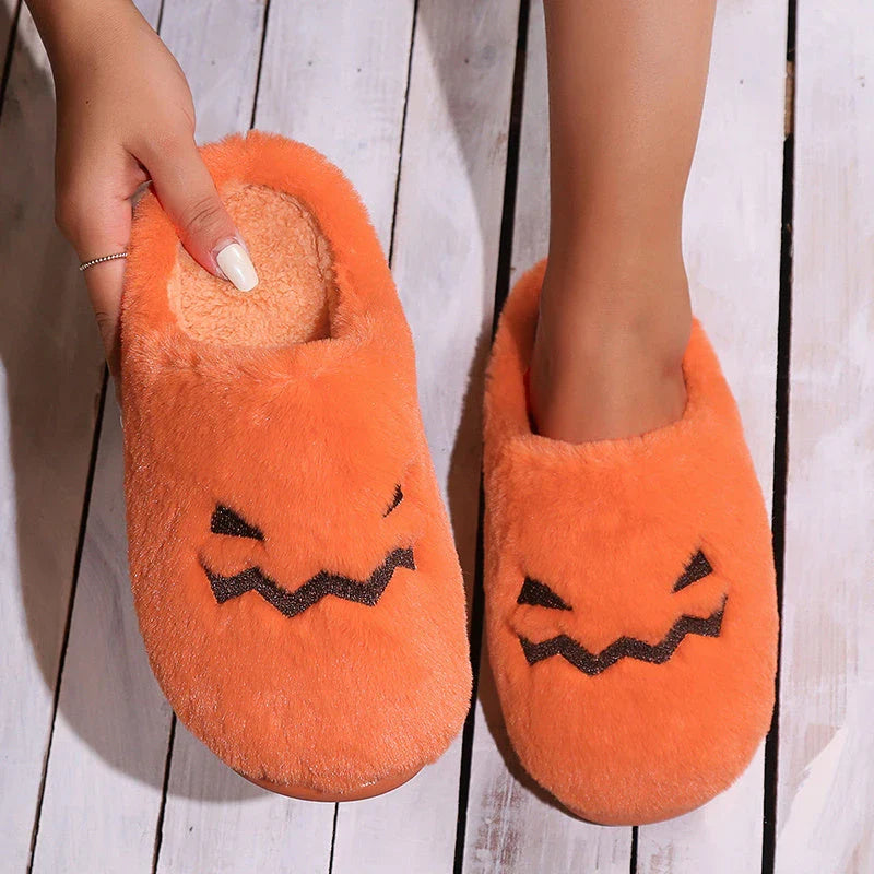 Cozy pumpkin-themed slippers with plush coral velvet upper and non-slip PVC sole for comfortable indoor wear